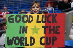 A young Sheffield United fan sends a pre-World Cup message to lliman Ndiaye at Cardiff City: Darren Staples / Sportimage