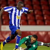 Former Sheffield Wednesday striker Nathan Modest has joined Carlton Palmer at Grantham Town.
