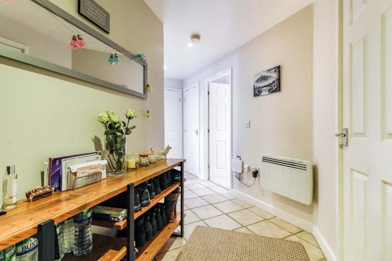 Spacious hall entrance with storage cupboard,