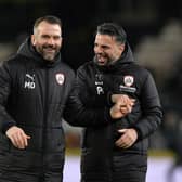 Martin Devaney celebrates Barnsley's win over Hull City earlier this season with former head coach Poya Asbaghi.