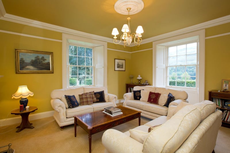 We hope you like yellow! Here's one of the two reception rooms in the house. There's also a study.