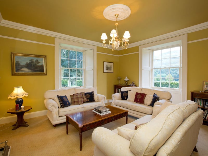 We hope you like yellow! Here's one of the two reception rooms in the house. There's also a study.