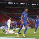 England's Dominic Calvert-Lewin celebrates after scoring his side's opening goal during the World Cup 2022 group I qualifying match between England and San Marino at Wembley stadium. (Carl Recine/Pool Photo via AP)