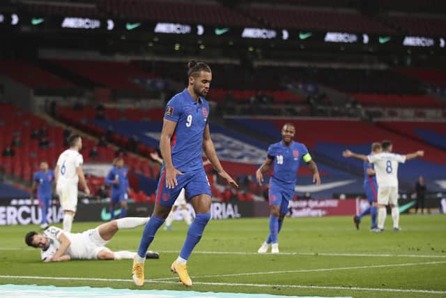 England's Dominic Calvert-Lewin celebrates after scoring his side's opening goal during the World Cup 2022 group I qualifying match between England and San Marino at Wembley stadium. (Carl Recine/Pool Photo via AP)