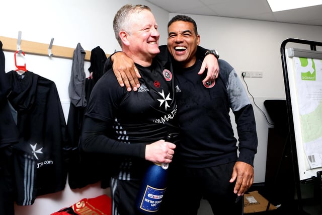 Wilder and team psychologist Steve Sylvester celebrate winning promotion to the Sky Bet Championship after a 2-1 win at Northampton Town in April 2017.