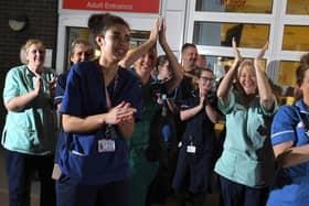 Hospital staff joining in with the clap for carers during the pandemic