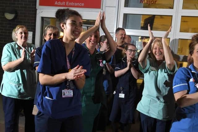 Hospital staff joining in with the clap for carers during the pandemic