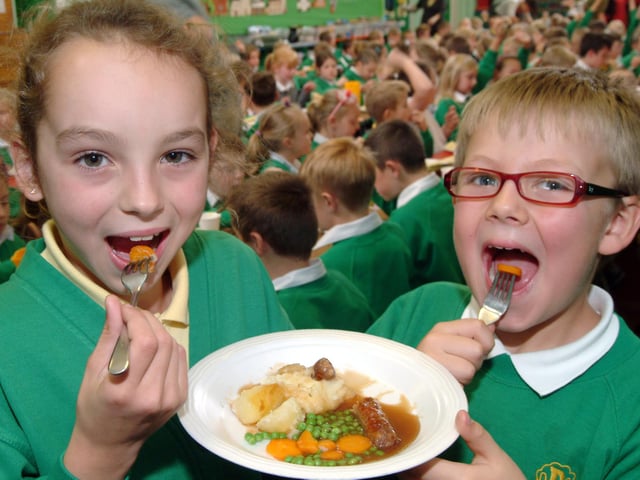 160 pupils at Kirkby's Orchard Primary School, double the usual number of children eating school dinners gathered in 2009 for a Harvest Lunch. Pictured are pupils Abigail Hardy and Alex Lee both eight.