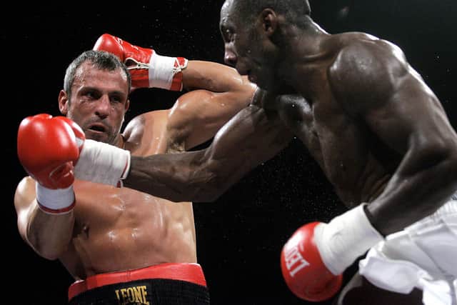 Sheffield's Johnny Nelson (right) in action against Vincenzo Cantatore in 2005. He has been made an MBE in the King's New Year Honours. Photo: GIULIO NAPOLITANO/AFP via Getty Images
