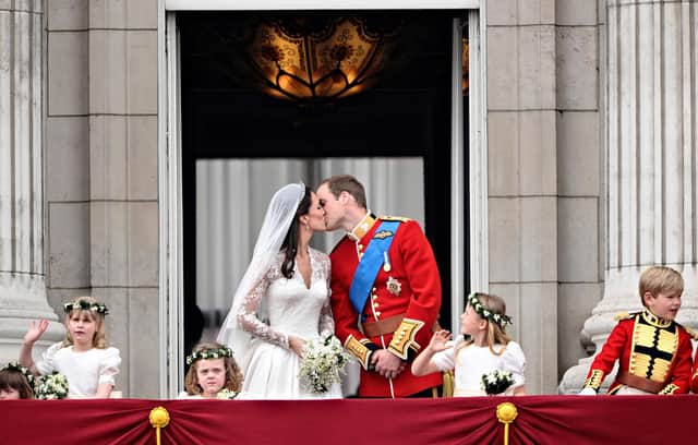 The Duke and Duchess of Cambridge share a kiss on the balcony at Buckingham Palace after their wedding 10 years ago. Photo: Leon Neal/AFP/Getty Images