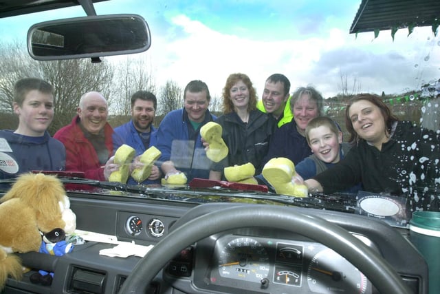 Emma Laver right and sponsored car washers for the NSPCC in  2002