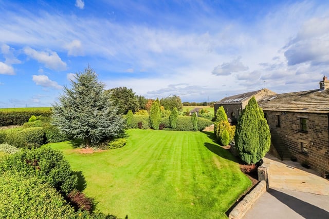 The property is set on a plot which extends across four acres, complete with thoughtfully landscaped gardens to the front and side of the house, paddocks and a stone flagged outdoor entertainment area.