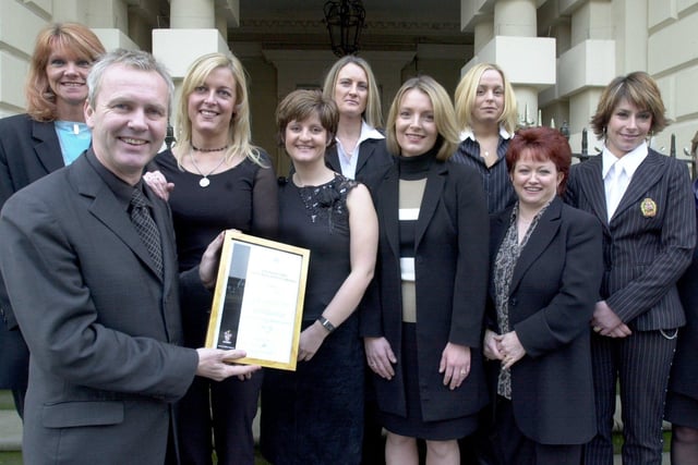Left, Andrew Collinge presents awards to hairdressers, l/r: Joanne Hinchliffe-Wood, Hilary Sugars, Judith Brown, Clare White, Ruth Langley, Donna Pollitt, Glenys Woods and Nicky Harrod, at the Mansion House, Doncaster in 2001