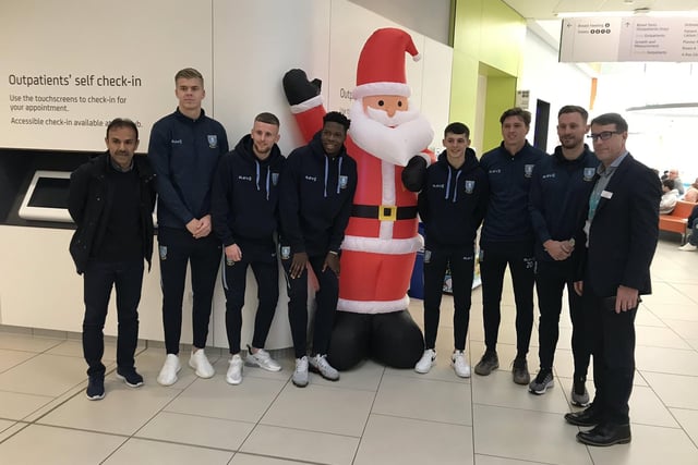 Wednesday manager Jos Luhukay and players at Sheffield Children's Hospital in December 2018.