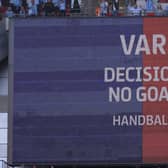 An LED screen displays a VAR message that the goal scored by Joe Taylor of Luton Town was disallowed. (Photo by Richard Heathcote/Getty Images)
