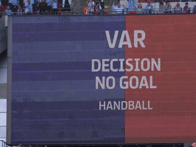 An LED screen displays a VAR message that the goal scored by Joe Taylor of Luton Town was disallowed. (Photo by Richard Heathcote/Getty Images)
