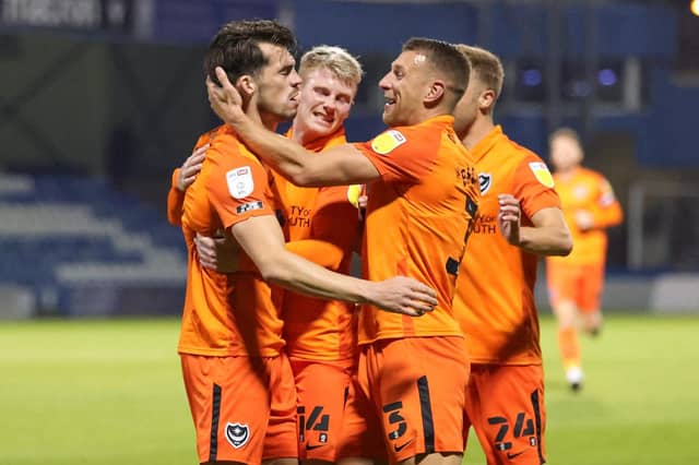 John Marquis is congratulated following his opener against Gillingham. Picture: Nigel Keene