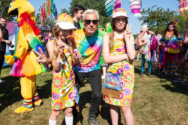 John Giddings with fancy dress hippy girls