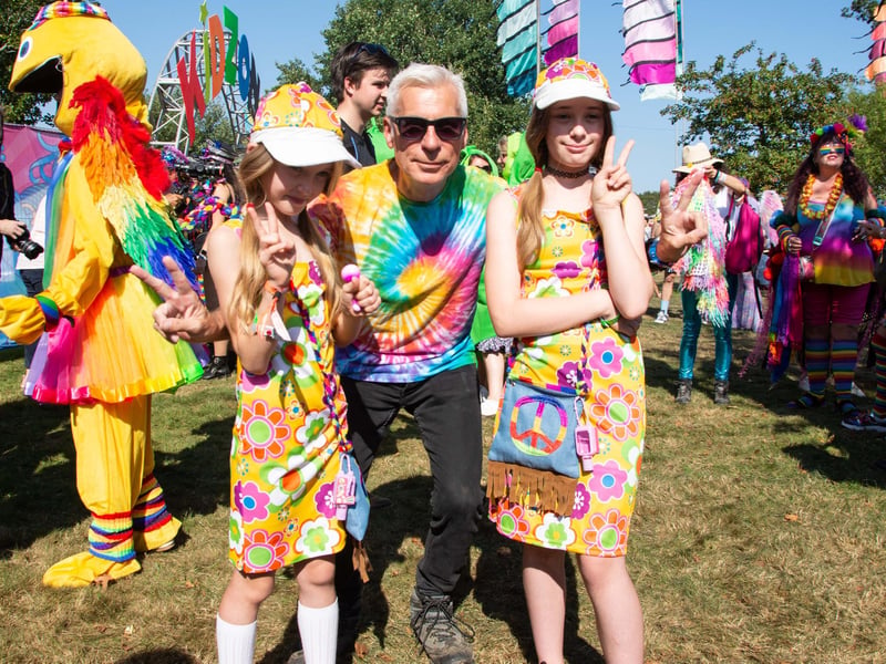 John Giddings with fancy dress hippy girls