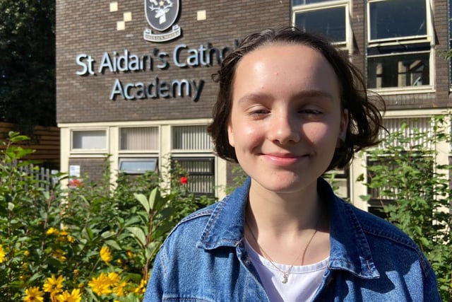 Callie McGinty stops to have her photograph taken on GCSE results day. She secured seven 9s and four 8s and said: It is better than I expected, I feel really relieved.