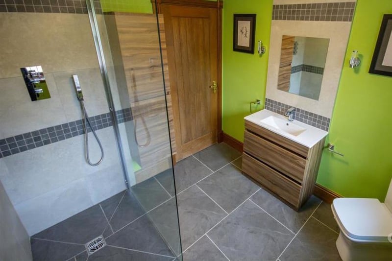 Cool off in this modern shower room. It is a stylish suite, complete with walk-in shower, low-flush WC, radiators, wash hand-basin and window to the back.