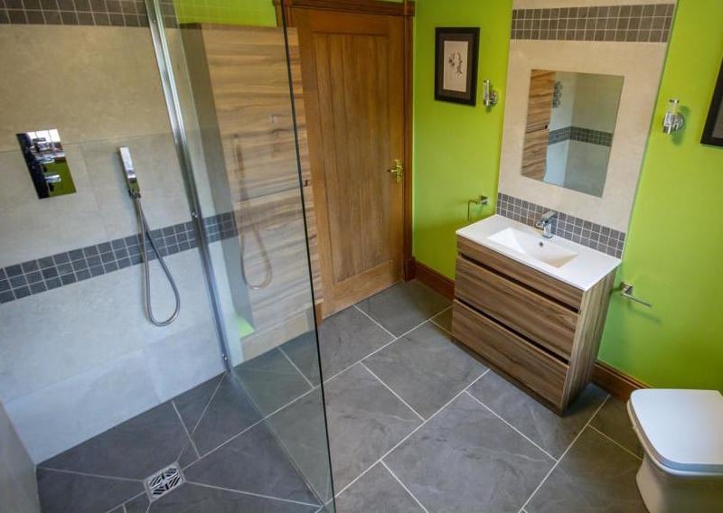 Cool off in this modern shower room. It is a stylish suite, complete with walk-in shower, low-flush WC, radiators, wash hand-basin and window to the back.
