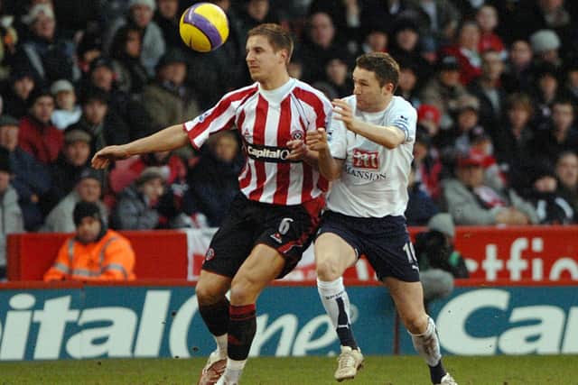 Sheffield United's Phil Jagielka battles with Tottenham Hotspur's Robbie Keane: Anna Gowthorpe/PA Wire.