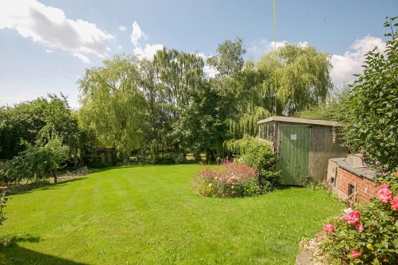 There is a beautiful, substantial landscaped enclosed rear garden with lawn and patio.
