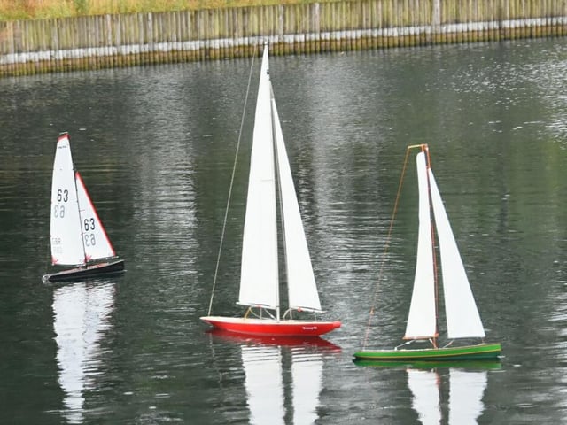 A group of enthusiasts sailing their remote control yachts at Lakeside