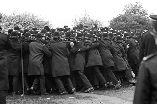 Police officers pushing against striking miners outside the Orgreave Coking Plant near Rotherham. . Photo: PA Wire