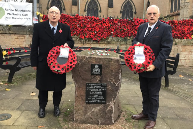 Hucknall councillors John Wilmottt (left) and Dave Shaw prepare laid wreaths at the war memorial in in the market place