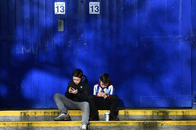 Two young Sheffield Wednesday supporters take it all in ahead of their match with Millwall earlier this season.