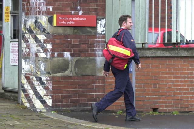 A postman leaves Pond Street sorting office in Sheffield