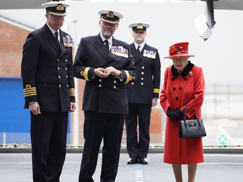 Queen Elizabeth II meeting personnel during a visit to HMS Queen Elizabeth at HM Naval Base, Portsmouth, ahead of the ship's maiden deployment. The visit comes as HMS Queen Elizabeth prepares to lead the UK Carrier Strike Group on a 28-week operational deployment travelling over 26,000 nautical miles from the Mediterranean to the Philippine Sea. Picture: Steve Parsons/PA Wire