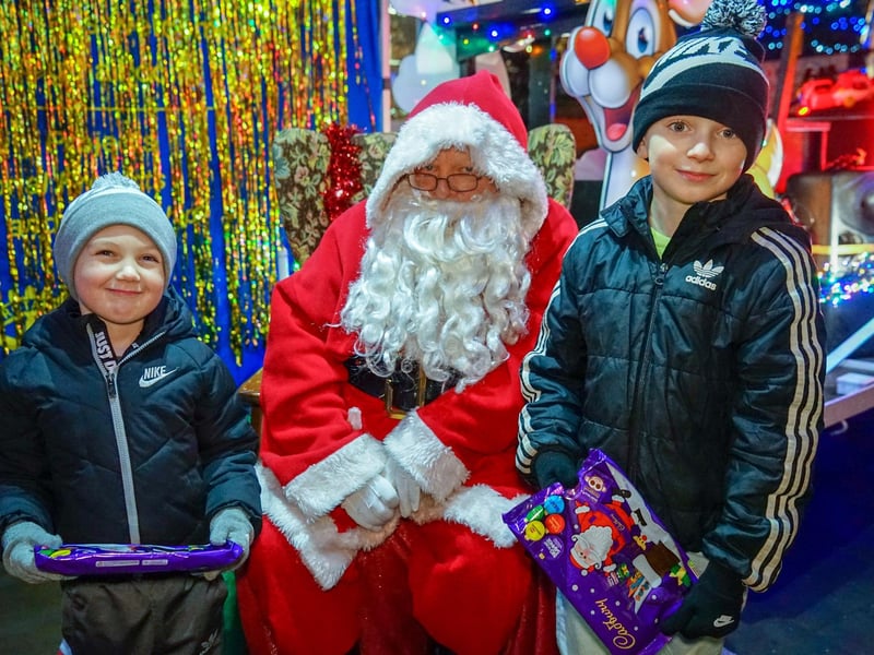 Hayley and Jenson meet Santa on the Rotary Club stand