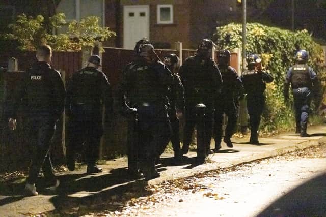 Police on scene in the Greater Manchester area following the arrest of three men over a drive-by shooting in Quinney Crescent. A juvenile was also arrested in Sheffield as part of the coordinated operation.