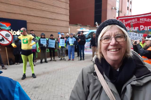 Fran Postlethwaite, of Better Buses for South Yorkshire, with Richard Teasdale of Act Now Sheffield as a climate 'super hero' behind, at a recent protest over bus services in South Yorkshire