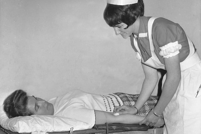 Nurse B Scott chats to a donor who is giving a donation of blood at a National Blood Transfusion Service session in Sunderland in August 1965.
