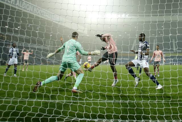 Sheffield United's Lys Mousset kicks his shot at goal over the net during the English Premier League soccer match between West Bromwich Albion and Sheffield United at The Hawthorns: Andrew Boyers/Pool via AP