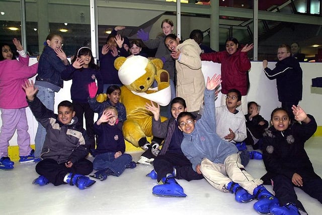 Theo the Bear from Sheffield Children's Hospital meets schoolchildren on the ice at iceSheffield, October 22, 2003
