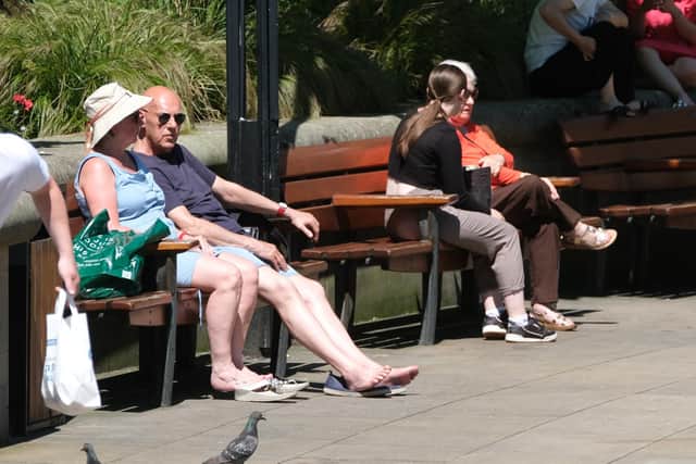 People enjoying the sun in Sheffield city centre