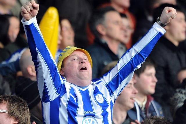 A Wednesday supporter celebrates his side's opening goal against Blackpool in the fourth round in January 2012.