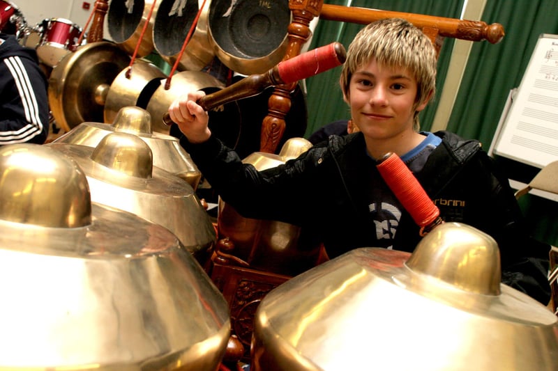 Bradley McArdle enjoys trying out percussion instruments brought to The Bolsover School by  Indonesian musicians in 2007.