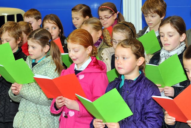 Pupils from St John Vianney Primary School singing carols nine years ago.