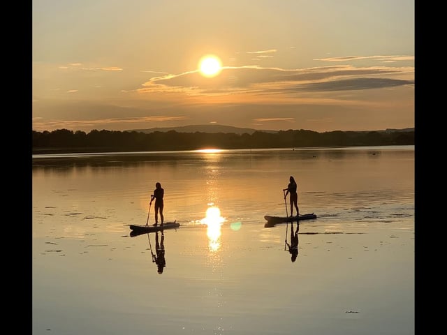 Paddle boarders out bright and early enjoying the sunrise at Langstone harbour.