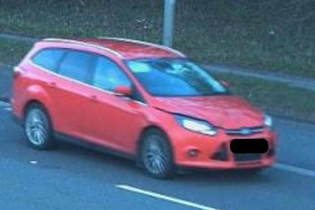 Police are appealing to trace this pictured, red-coloured Ford Focus after an elderly woman was injured following a burglary on St Helen's Close, at Thurnscoe, near Barnsley, on Wednesday, March 22.
