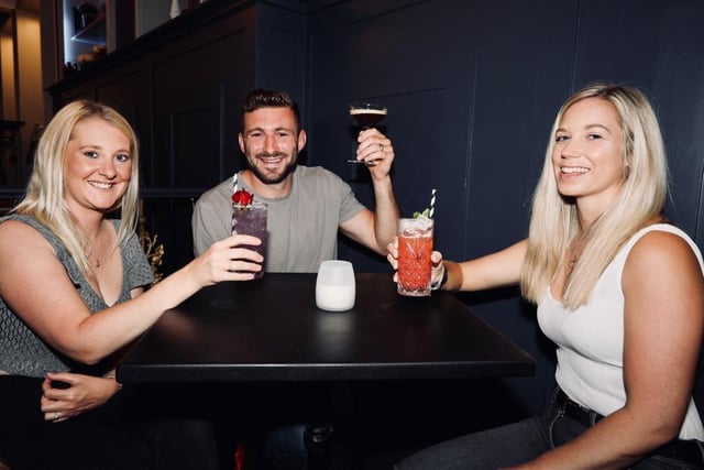 Pubs reopened on Saturday, July 4 - (l to r) Katie and Liam Perkins, and Alice Hosker, drinking in the Monarch.  Picture: Chris Moorhouse