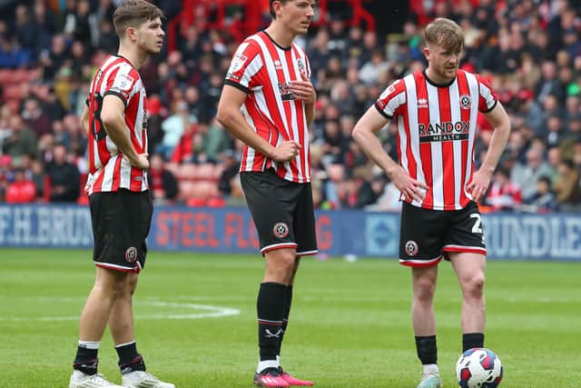 James McAtee (left) and Tommy Doyle (right) with Sheffield United team mate Sander Berge: Simon Bellis / Sportimage