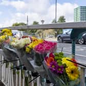 Flowers at the scene of a RTC on Moore Street. 23 year old Junaid Latif died in hospital on Sunday. Picture Scott Merrylees