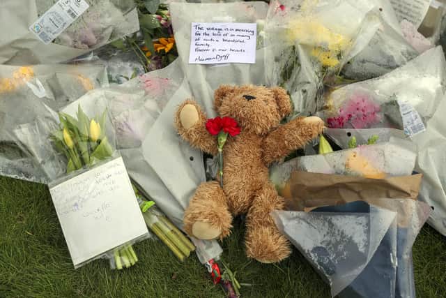 Floral tributes laid outside Chinnor Community Church in Chinnor, Oxfordshire, in memory of Zoe Powell, 29, and her three children - Phoebe, eight, Simeon, six, and Amelia, four - who were killed in a car accident on the A40 near Oxford on Monday night. - PA